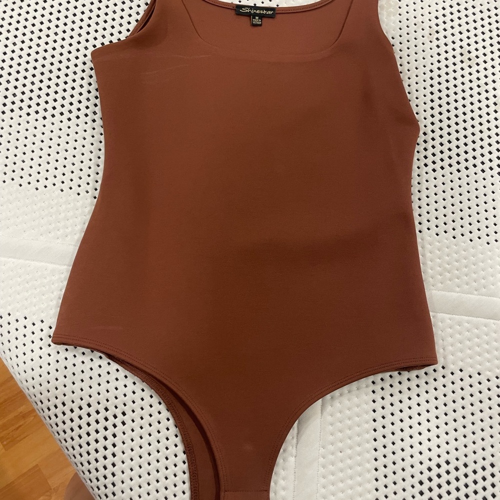 Brown body suit